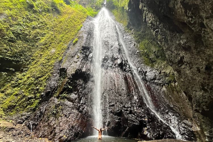 bathing under a 20m waterfall,