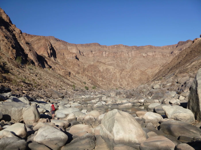 There are some big boulder fields to negotiate in the first couple of days so a trekking pole is handy - Pic Shaen Adey Image