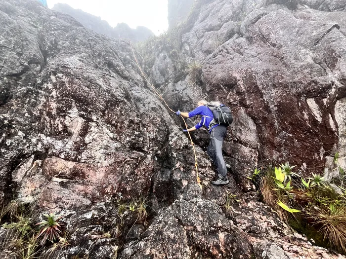 Climbing Up the side of a rocky area