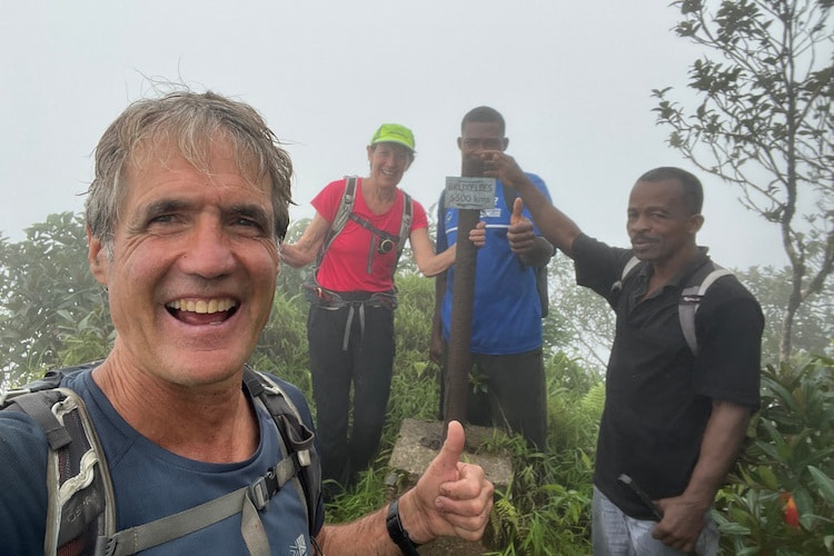 Standing near an attached card stating ‘Bruxelles 5500kms