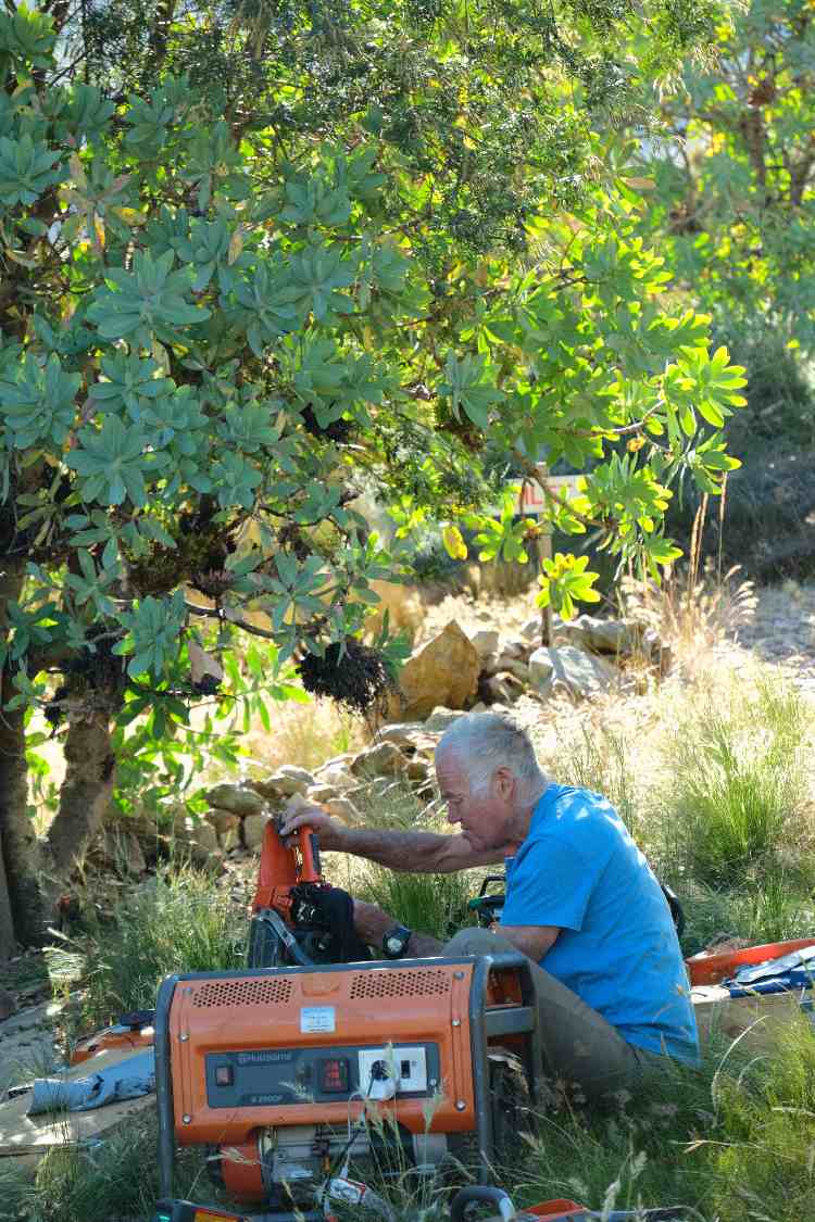 Alex Mckirdy checking tree felling equipment.