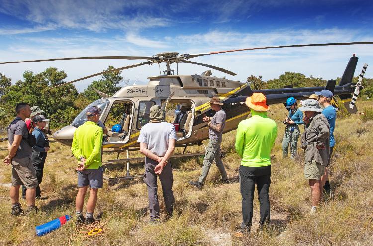 A gathering around the helicoper