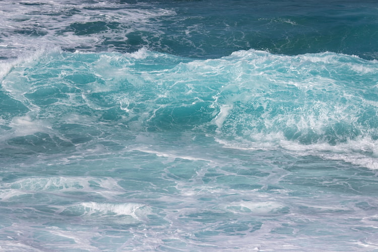 The waves of the ocean beautifully crashing.