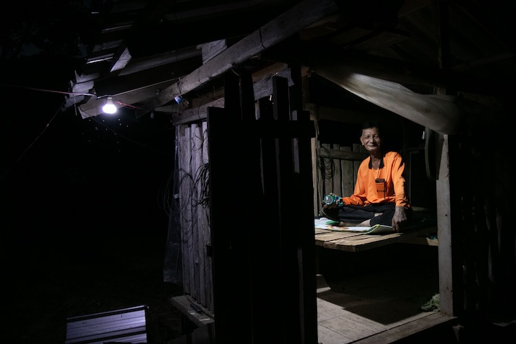 P’ Aod guards his crop from elephants at night in this shelter he built on his field himself.